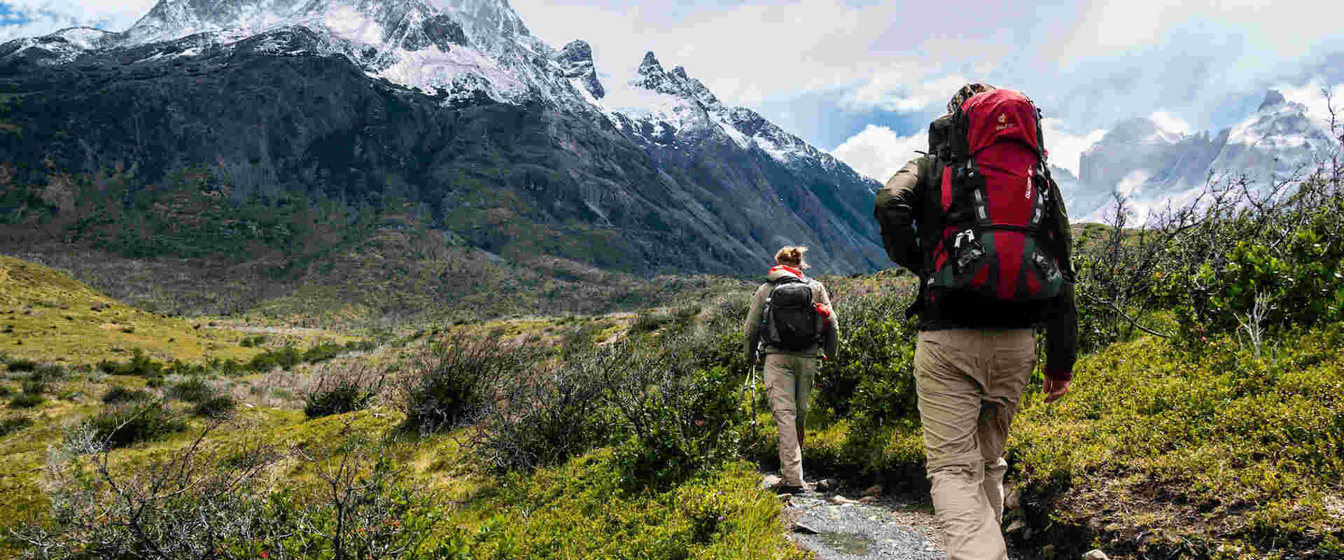Two people hikking mountains with Hiking GPS tracker
